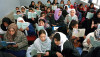 Schoolgirls reading in classroom, Zarghuna Girls School, Afghanistan